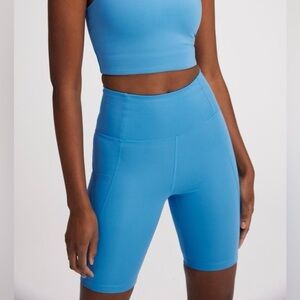 Girlfriend Collective High Rise Pocket Bike Shorts in Haze